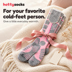 HottySocks heated socks tied with a ribbon as a gift